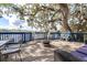 Outdoor deck has beautiful lake views, a fire pit, and comfortable seating, creating a relaxing atmosphere at 1048 Sunset Trail, Babson Park, FL 33827