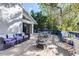 Spacious wooden deck with ample seating and a fire pit, perfect for outdoor relaxation and entertaining at 1048 Sunset Trail, Babson Park, FL 33827