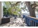 Lakefront deck has outdoor furniture and fire pit at 1048 Sunset Trail, Babson Park, FL 33827
