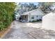 Charming single-story home featuring a spacious driveway and shed for extra storage at 1048 Sunset Trail, Babson Park, FL 33827