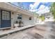 Well-maintained home exterior with a neat driveway, decorative plants, and tidy shed enhances curb appeal at 1048 Sunset Trail, Babson Park, FL 33827