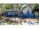 Lake house featuring a large deck, beach access, and entertainment space by the water at 1048 Sunset Trail, Babson Park, FL 33827