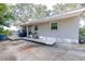 Outdoor patio with grill, comfortable seating, and stylish decor perfect for relaxing and entertaining at 1048 Sunset Trail, Babson Park, FL 33827