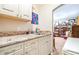 Laundry area features counters and cabinets with a view to bedroom at 1048 Sunset Trail, Babson Park, FL 33827