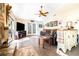 Bright and airy living room features tile flooring, a ceiling fan, and french doors at 1048 Sunset Trail, Babson Park, FL 33827