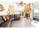 Open-concept living room boasting natural light, a fireplace, and tile flooring at 1048 Sunset Trail, Babson Park, FL 33827
