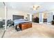 Expansive main bedroom featuring a large layout, a ceiling fan, and dual walk-in closets at 1048 Sunset Trail, Babson Park, FL 33827