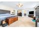Spacious main bedroom with ceiling fan, carpet flooring, and large dresser at 1048 Sunset Trail, Babson Park, FL 33827