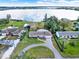 Aerial view of the home, situated on a large lot with waterfront access and lush landscaping at 106 Lake Sears Dr, Winter Haven, FL 33880
