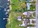 Aerial view of the property showing its location, proximity to water, and surrounding landscape at 106 Lake Sears Dr, Winter Haven, FL 33880