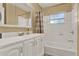 Bathroom features a vanity, mirror, combination shower and tub at 106 Lake Sears Dr, Winter Haven, FL 33880