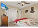Bedroom features a TV, closet, and decorative turkey and deer at 106 Lake Sears Dr, Winter Haven, FL 33880