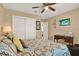 Bedroom with comfortable bed, side table, and white closet at 106 Lake Sears Dr, Winter Haven, FL 33880