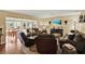 Bright living room with comfortable seating and natural light offers a cozy and welcoming atmosphere for gatherings and relaxation at 106 Lake Sears Dr, Winter Haven, FL 33880