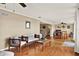 Spacious living area with comfortable seating, hardwood floors, and natural light creates an inviting atmosphere for relaxation and gatherings at 106 Lake Sears Dr, Winter Haven, FL 33880