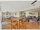 Spacious living area with a dining table and chairs, couches, and an entertainment center, offering ample room for various activities at 106 Lake Sears Dr, Winter Haven, FL 33880