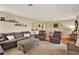 Inviting living room features plush sofas, a cozy rug, and stylish decor, perfect for relaxation and entertaining at 106 Lake Sears Dr, Winter Haven, FL 33880