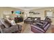 Relaxing living room features comfortable seating, a fireplace, and stylish decor, perfect for relaxation and entertaining at 106 Lake Sears Dr, Winter Haven, FL 33880