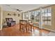 Bright living room with hardwood floors, lots of natural light, and a comfortable armchair at 106 Lake Sears Dr, Winter Haven, FL 33880