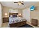 Cozy main bedroom featuring a dark wood bed, a TV, and ample storage space at 106 Lake Sears Dr, Winter Haven, FL 33880