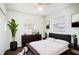 Airy bedroom with white walls and a large window, complete with a modern dresser at 110 Shirley Ct, Eagle Lake, FL 33839