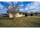 A front exterior shot of a home with a well-maintained lawn and landscaping at 110 Shirley Ct, Eagle Lake, FL 33839