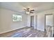 Light and airy bedroom with wood-look floors and closet at 114 Bishop St, Auburndale, FL 33823