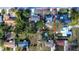 Drone's view of the house in its neighborhood, displaying the layout and surrounding homes at 115 Jefferson St, Lake Wales, FL 33859