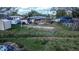 View of the fenced backyard showcasing yard size and surrounding residential area at 115 Jefferson St, Lake Wales, FL 33859