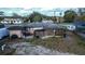 Aerial shot of the backyard showing the structure's layout and surrounding neighborhood at 115 Jefferson St, Lake Wales, FL 33859