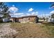 Wide view of the yard with a detached structure and various yard features at 115 Jefferson St, Lake Wales, FL 33859