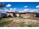Backyard area with sparse grass and a detached trailer at 115 Jefferson St, Lake Wales, FL 33859