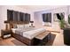 A simple bedroom with a stylish wooden bed is perfect for unwinding and resting well at 115 Jefferson St, Lake Wales, FL 33859