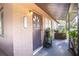 Inviting front porch with a charming front door and space for decorative plants at 115 Jefferson St, Lake Wales, FL 33859