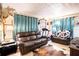 Comfortable living room featuring a leather sofa and a traditional homey decor at 115 Jefferson St, Lake Wales, FL 33859