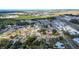 Aerial shot showcasing this home's position within a residential neighborhood, with nearby amenities at 115 Jefferson St, Lake Wales, FL 33859