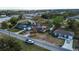 Aerial perspective of a home in relation to its neighborhood, showcasing its setting and nearby residences at 115 Jefferson St, Lake Wales, FL 33859
