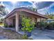 Inviting covered porch with a cozy seating arrangement and pleasant outdoor ambiance at 115 Jefferson St, Lake Wales, FL 33859