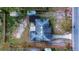 Overhead view of property lines, showing lot size, house placement, and surrounding landscape at 115 Jefferson St, Lake Wales, FL 33859