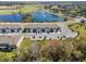Aerial view of the homes with a lake and the community golf course at 1157 Blue Jay Dr, Davenport, FL 33837