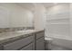 Bright bathroom features a granite countertop, a tub, and white tile surround at 1157 Blue Jay Dr, Davenport, FL 33837