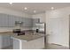Modern kitchen featuring stainless steel appliances and neutral-toned cabinets at 1157 Blue Jay Dr, Davenport, FL 33837