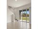 Open living area with sliding glass doors to the backyard and stairs to the second floor at 1157 Blue Jay Dr, Davenport, FL 33837