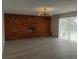 Large living room with brick fireplace and sliding doors to the backyard at 148 Lake Otis Rd, Winter Haven, FL 33884