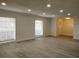 Spacious living room with new flooring, recessed lighting, and large windows for ample natural light at 148 Lake Otis Rd, Winter Haven, FL 33884