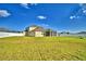 Large back yard featuring green grass extending from home to fence, ideal for recreation at 1510 Shorewood Dr, Auburndale, FL 33823
