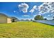 Beautiful backyard with lush green grass and a clean white fence for added privacy at 1510 Shorewood Dr, Auburndale, FL 33823