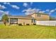 Spacious backyard features a screened-in patio and white privacy fence at 1510 Shorewood Dr, Auburndale, FL 33823