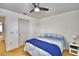This bedroom offers a ceiling fan and seamless access to other areas of the house at 1510 Shorewood Dr, Auburndale, FL 33823