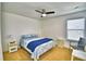 Cozy bedroom with a ceiling fan, natural light, and neutral carpeting, creating a comfortable retreat at 1510 Shorewood Dr, Auburndale, FL 33823